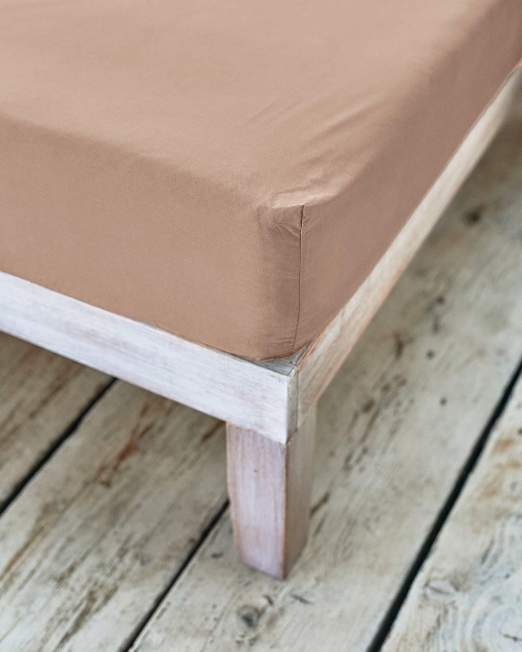 corner of beige fitted sheet