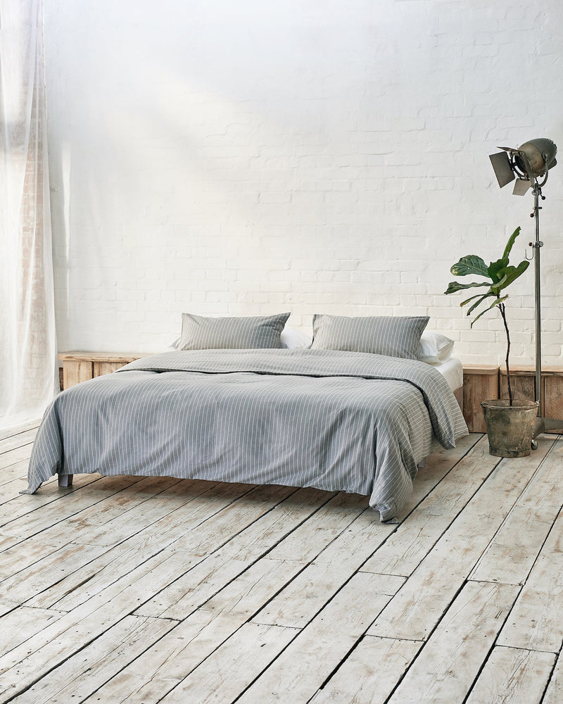 Modern bedroom with exposed brick wall