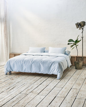 Modern bedroom with exposed brick wall