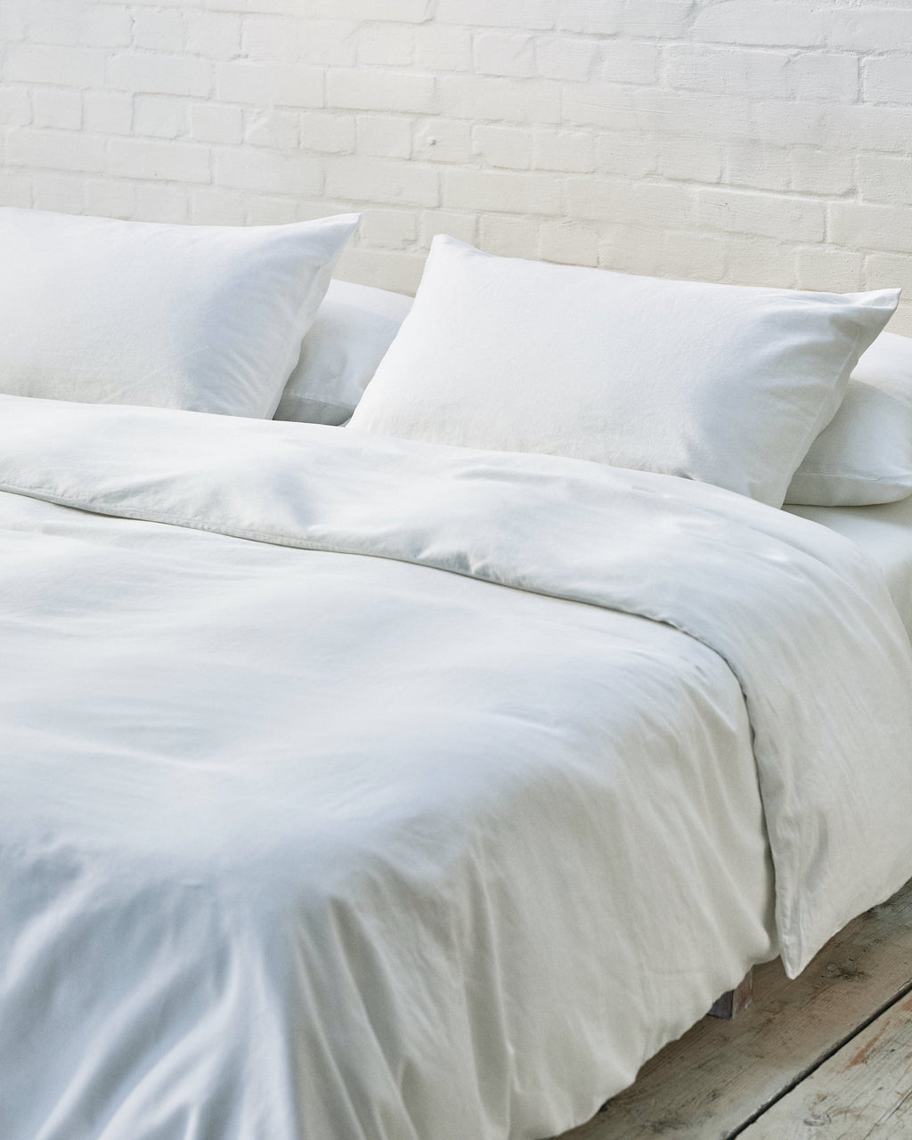 Modern bedroom with exposed brick wall